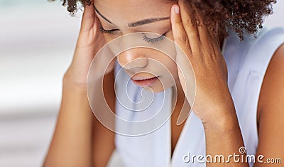 Close up of african young woman touching her head Stock Photo