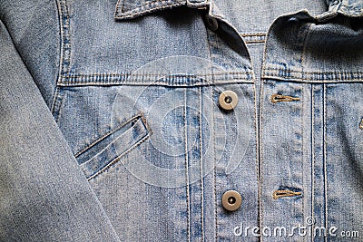 Close up aged denim texture. Old blue jeans jacket with stiched Stock Photo