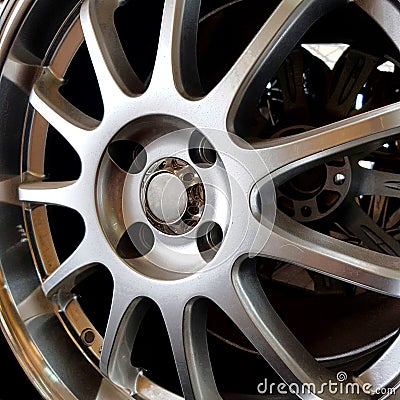 Close up of alloy wheels on shelves Stock Photo