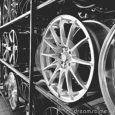 Close up of alloy wheels on shelves Stock Photo