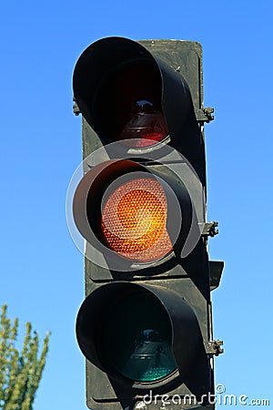 Amber traffic light in San Modesto street in Madrid, Spain. Stock Photo
