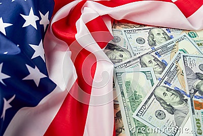 Close up of american flag and dollar cash money. Dollar banknote and United States flag background. Economy of USA Stock Photo