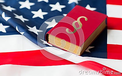 Close up of american flag and lawbook Stock Photo