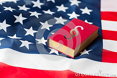 Close up of american flag and lawbook Stock Photo