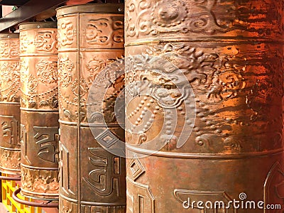 Close-up of ancient prayer copper wheel in Buddhist Temple Stock Photo