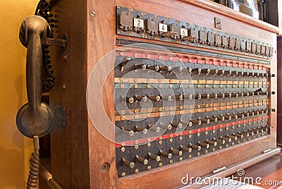 Close up of antique vintage telephone switch board, telecommunication wood box. Editorial Stock Photo