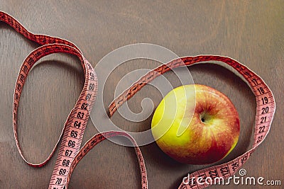 Close up apple, meter tape. Concept Healthy way of life Stock Photo