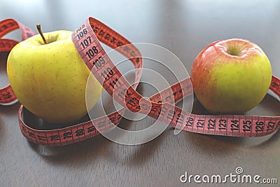 apple, meter tape. Stock Photo