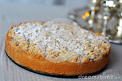 Close up of a apple pie and powdered sugar on it Stock Photo