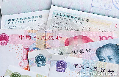 Close up of approved China travel Visa and Chinese currency Yuan banknotes money Stock Photo