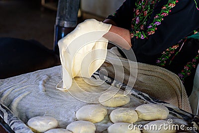 Muslim woman making food. Stock Photo