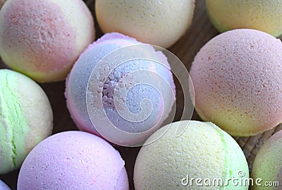 Close up aromatherapy spa bombs on desk. Many colored bath balls for beauty, skincare or relax. Stock Photo