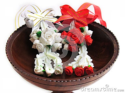 Close up Artificial Thai garlands made of clay, in a wooden tray Stock Photo