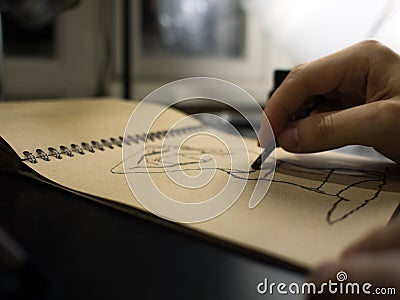 Close up of artists hand painting with graphite crayon Stock Photo