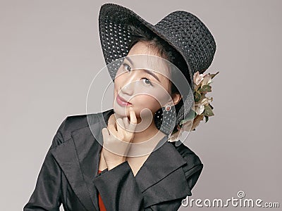 Close up of Asian beauty in fashion hat. Stock Photo