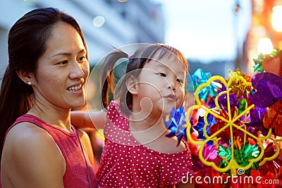Close-up of Asian chinese mother and daughter shopping in china town during festive seasons Stock Photo