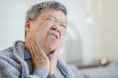 Elderly man has sore throat Stock Photo