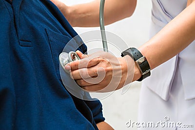 Close up of Asian Femal doctor listen to elderly patient`s heart Stock Photo