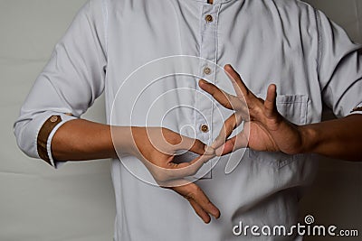 Close up Asian man shows hand gestures it means interpreter appreciation isolated on white background. American sign language Stock Photo