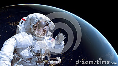 Close up of an astronaut in outer space, earth by night in the background Stock Photo