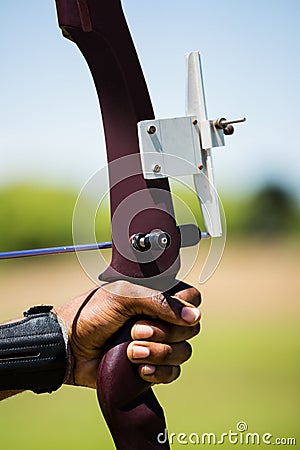 Close-up of athlete hand practicing archery Stock Photo