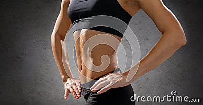 Close up of athletic female abs in sportswear Stock Photo