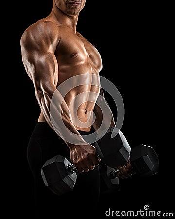 Close-up of athletic man pumping up muscles with dumbbell Stock Photo