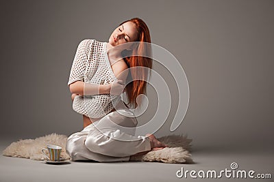 Gorgeous ginger woman on lilac background Stock Photo