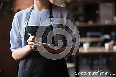 Close up attractive waitress ready to take order in coffeehouse Stock Photo