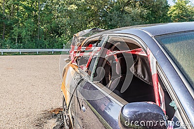 Close up of an Audi A3 after an accident with police barrier tape with German word for police barricade, Germany Stock Photo