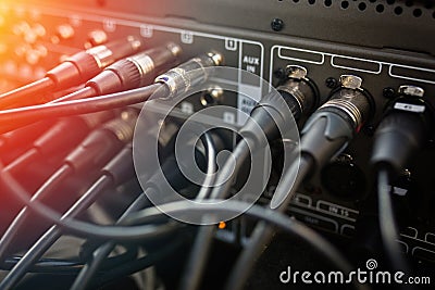 Close up audio jacks cable plugged into mixer console. XLR audio cable Stock Photo