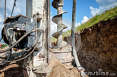 Close up of auger, industrial drilling rig making a hole Stock Photo