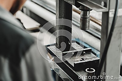 Close up of automechanic changing the silent block in the hydraulic press in the car service Stock Photo