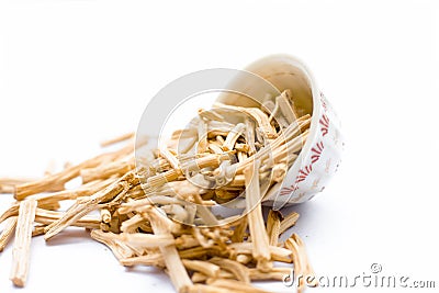 Close up of Ayurvedic herb Satavari or kurilo or Asparagus racemosus on white in a glass bowl. Stock Photo