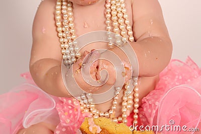 Close up of baby eating cake all messy Stock Photo