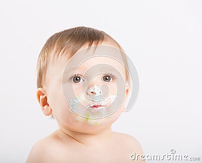 Close Up of Baby Face with Cake Icing Stock Photo