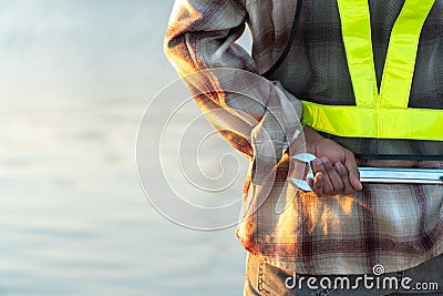 Close up back view of Engineers are hold equipment behind. Concepts of Construction and building Stock Photo