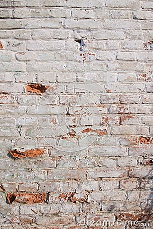 Close up background of brick wall, different shape adobe, vertical rough abstract shabby old worn surface texture Stock Photo