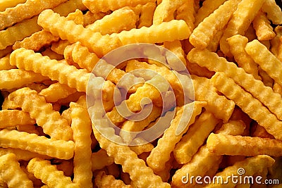 Close up background of crinkle cut fried chips Stock Photo