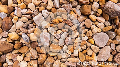 Small stones and pebbles scattered on the ground Stock Photo