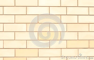 Close-up of a background of rectangles of pale yellow bricks Stock Photo