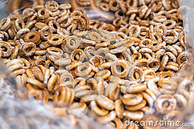 Close up of bagel buns at holiday fair. Bunch of sweet ring bun pastry for sale Stock Photo