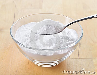 Close-up of baking soda on spoon. Stock Photo