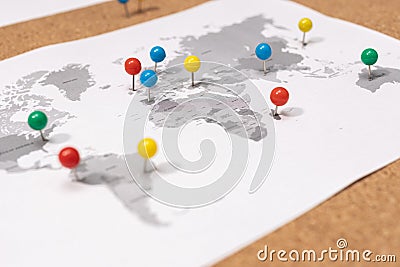 Close up of ball pins on world map on Corkboard Stock Photo