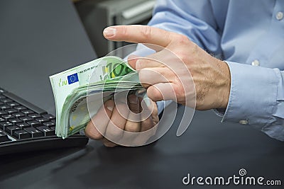 Close-up of bank clerk counting euros Stock Photo