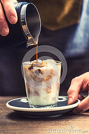 Close-up a barista making fres ice coffee on barcounter Stock Photo