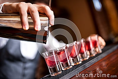 Close-up of barman hand pouring alcohol Stock Photo