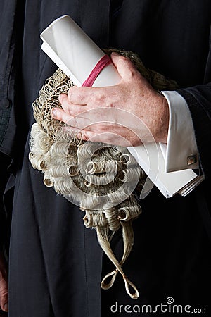 Close Up Of Barrister Holding Brief And Wig Stock Photo