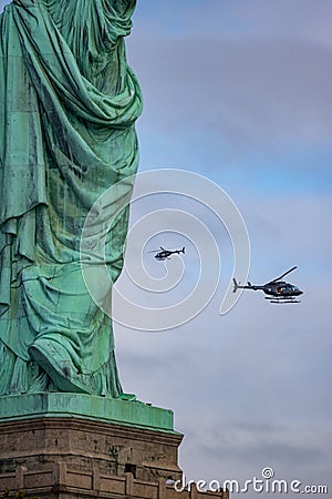 New York, New York - October 11, 2019 : Helicopters flying past the Statue of Liberty Editorial Stock Photo