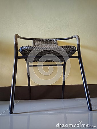 A basketry chair with steel chairs. Textured basketry chair furniture, selective focus. Stock Photo